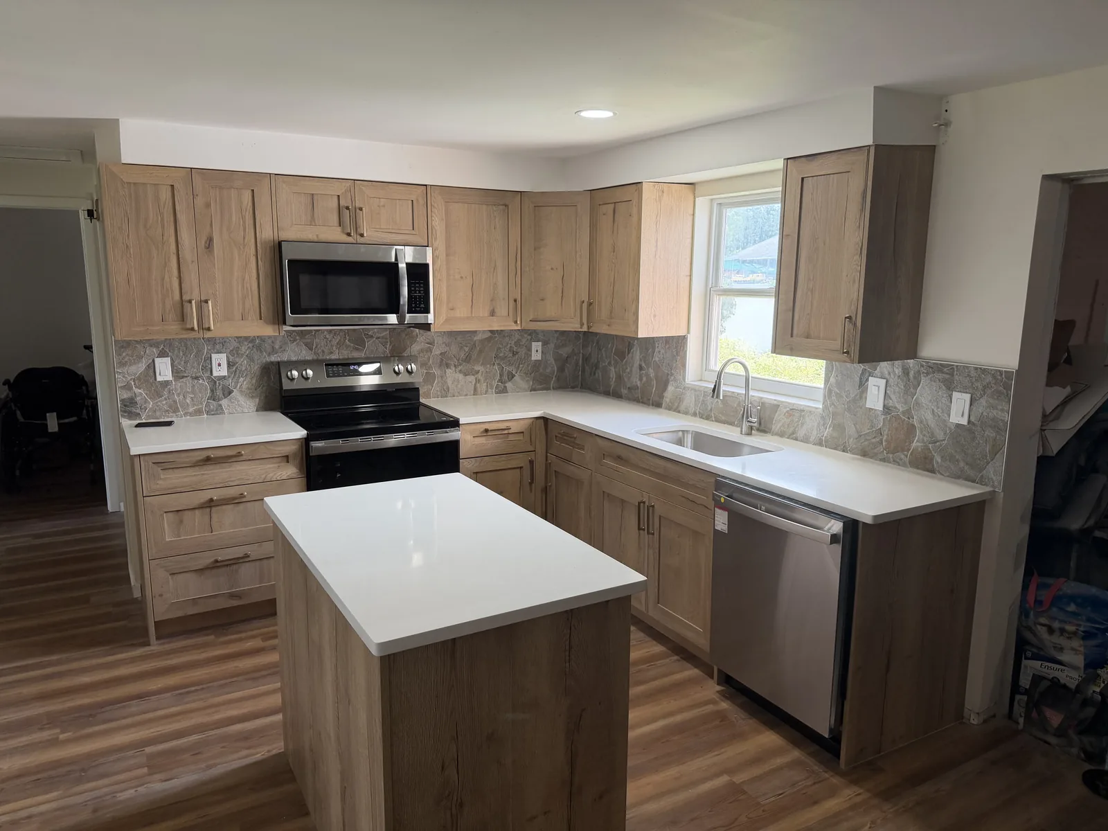 New wood shaker kitchen cabinets with soft-close doors, quartz countertops and stainless appliances